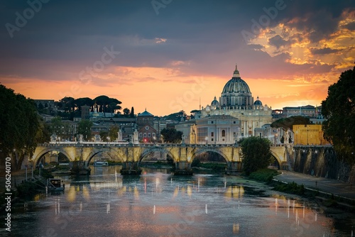Sunset view of old Sant' Angelo Bridge and St. Peter's cathedral in Vatican City, Rome.Italy © sleg21