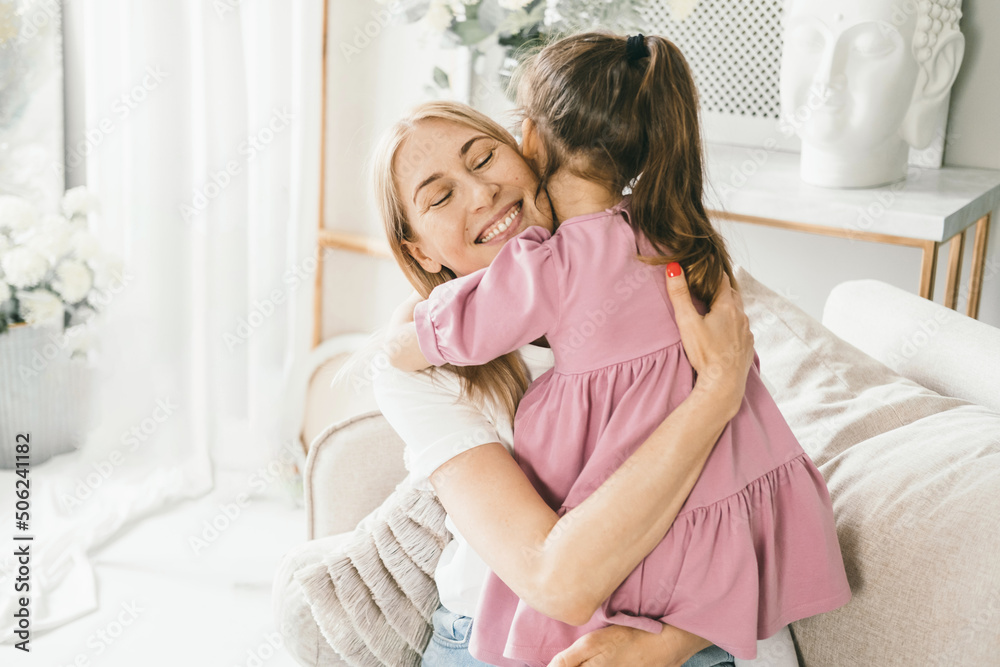 A little girl hugs her mother. Granddaughter hugs her grandmother. A little girl hugs her mother. Granddaughter hugs her grandmother.