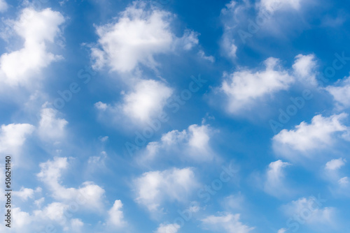 Background of white clouds in a blue sky  clouds leaving traces by the action of the wind.