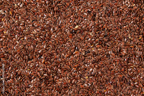 Heap flax seeds. Texture background.