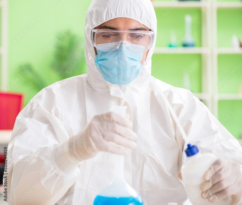 Chemist working in the lab on new experiment Chemist working in the lab on new experiment