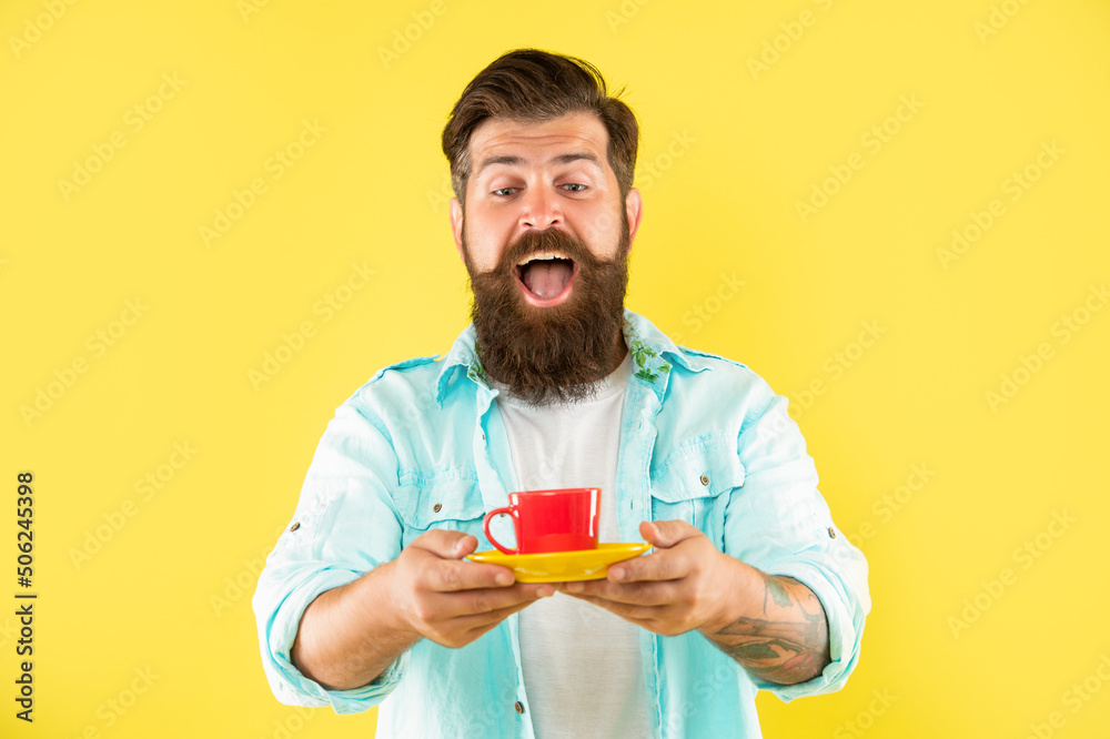 amazed unshaven man in shirt with coffee on yellow background, coffee amazed unshaven man in shirt with coffee on yellow background, coffee