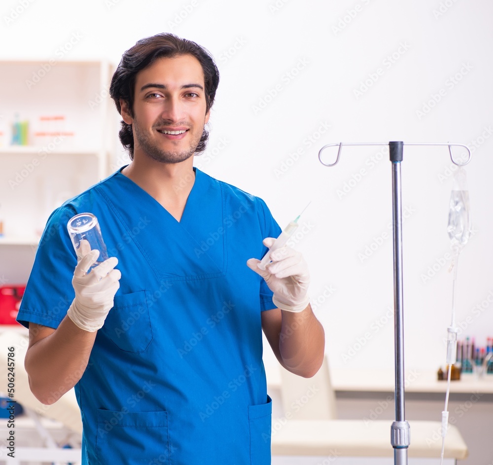The young male doctor in blood transfusion concept The young male doctor in blood transfusion concept