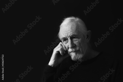 Low key studio black and white portrait of sad beautiful gray hair old man.  © frank11