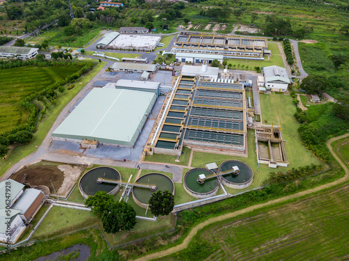 Aerial view of circular water treatment tank for cleaning up and recycling the contaminated wastewater from industrial estate photo