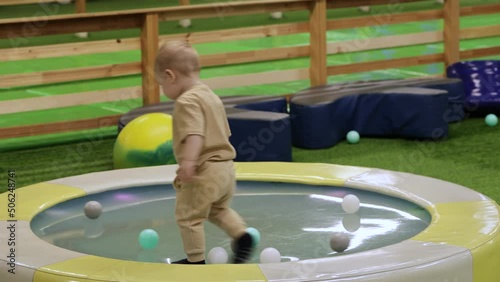 baby runs on a gel trampoline