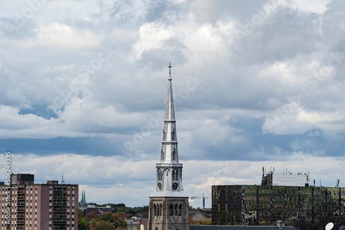 The tower of Saint Jacques Church is under construction on St. Denis street in Montreal, Quebec, Canada. photo