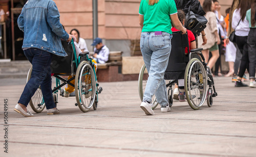people in wheelchairs on the street