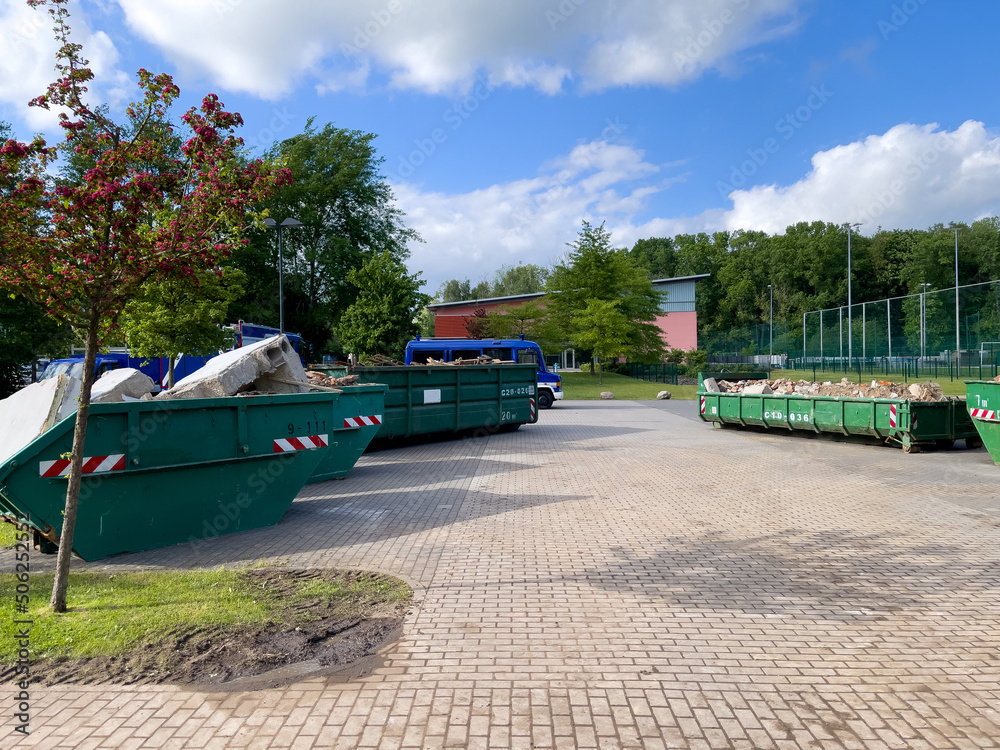 in some large containers there is the waste from a house demolition