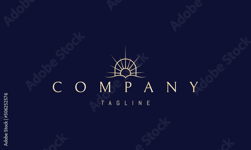 Vector golden logo on which an abstract image of an open book against the backdrop of a shining sun in the arch.
