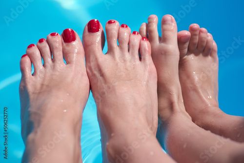 Family rest. Feet in the pool. Sea tourism. Hotel rest. Advertising for tourism