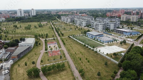 Drone view of Sei Milano, new GARDEN CITY  in the western suburbs near Bisceglie subway. Urban regeneration project and green revolution - the park near the new skyscrapers site 