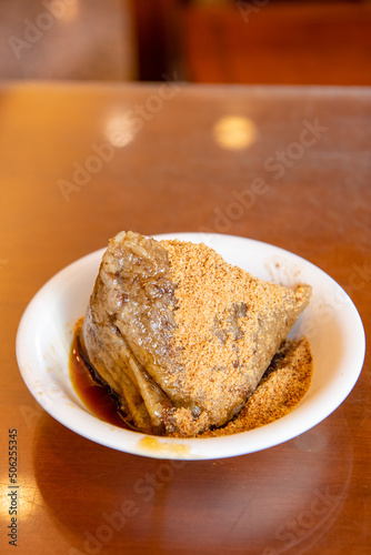 rice dumpling is a traditional Chinese rice dish made of glutinous rice and wrapped in bamboo leaves,