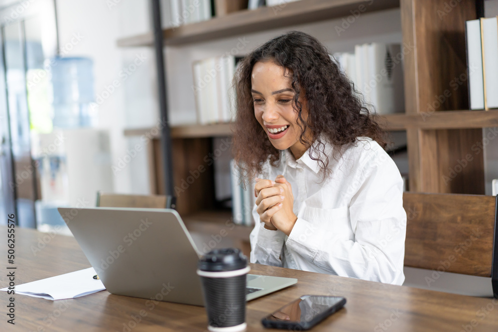 Happy business woman working with laptop computer in the office. Happy business woman working with laptop computer in the office.
