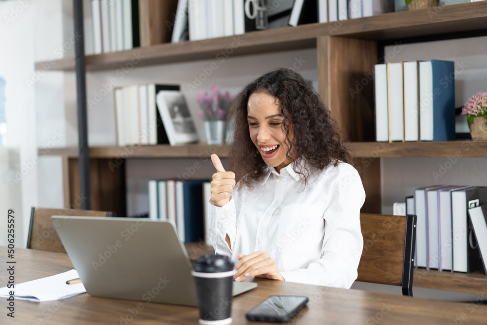 Happy business woman working with laptop computer in the office. Happy business woman working with laptop computer in the office.