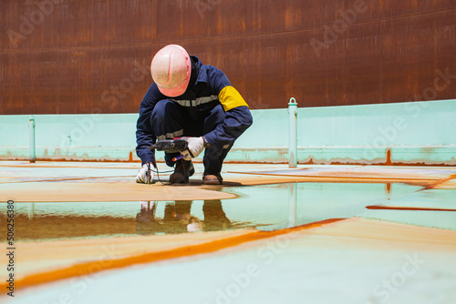 Fotografie, Tablou Male worker are for inspection ultrasonic thickness roof plate top