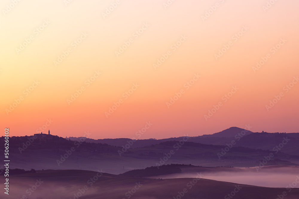 Sunrise with fog over a valley in Tuscany - Italy III