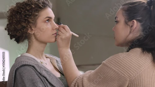 make-up artist makes models makeup