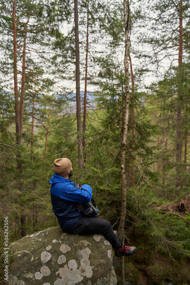 Relaxed male person looking upwards at the sky Relaxed male person looking upwards at the sky