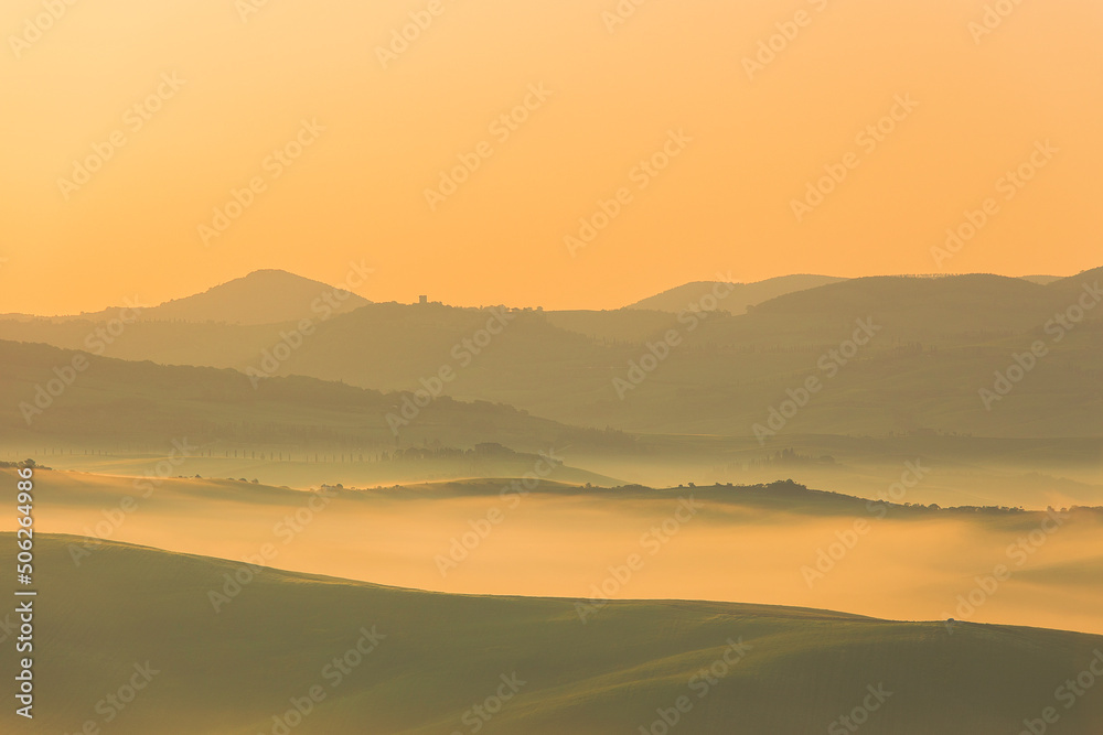 Sunrise with fog over a valley in Tuscany - Italy V