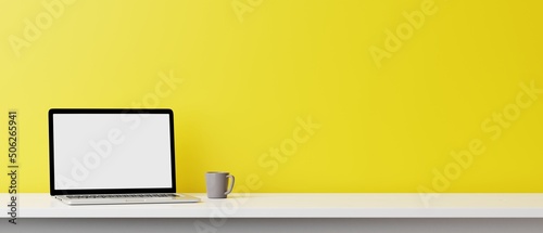 Blank computer laptop screen and various items on desktop workspace in yellow wall home office room. 3D renering illustration.