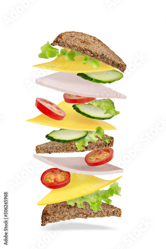 big sandwich with ham and cheese levitating on white background