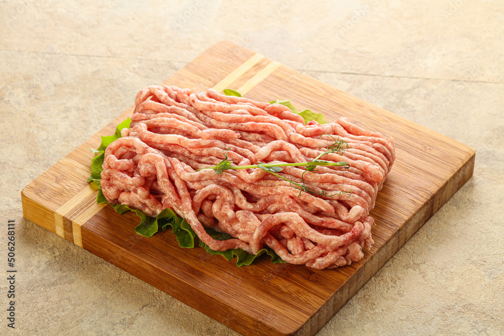 Raw minced pork meat over board Raw minced pork meat over board
