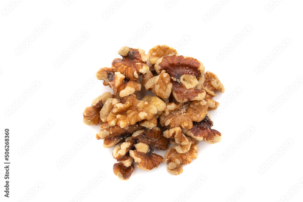 A handful of walnuts. Isolated on white background. Nuts are available in two forms, shell or shelled, and can be whole, halved, or in smaller portions due to processing. All nuts can be eaten plain A handful of walnuts. Isolated on white background. Nuts are available in two forms, shell or shelled, and can be whole, halved, or in smaller portions due to processing. All nuts can be eaten plain