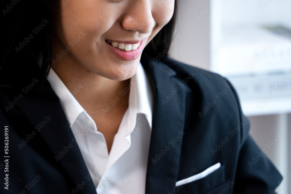 businesswoman smiling happily while working businesswoman smiling happily while working