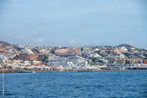 View on resorts and beaches of South coast of Tenerife island during sail boat trip along coastline, Canary islands, Spain © barmalini