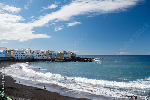 View on colorful houses and black lava rocks in small village Punta Brava near Puerto de la Cruz, Tenerife, Canary islands © barmalini