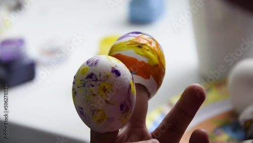 Children's craft made with eggshells painted with tempera, multi color school homework, primary school homework easter celebration.
