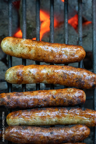 german sausage "bratwurst" on the grill with flame