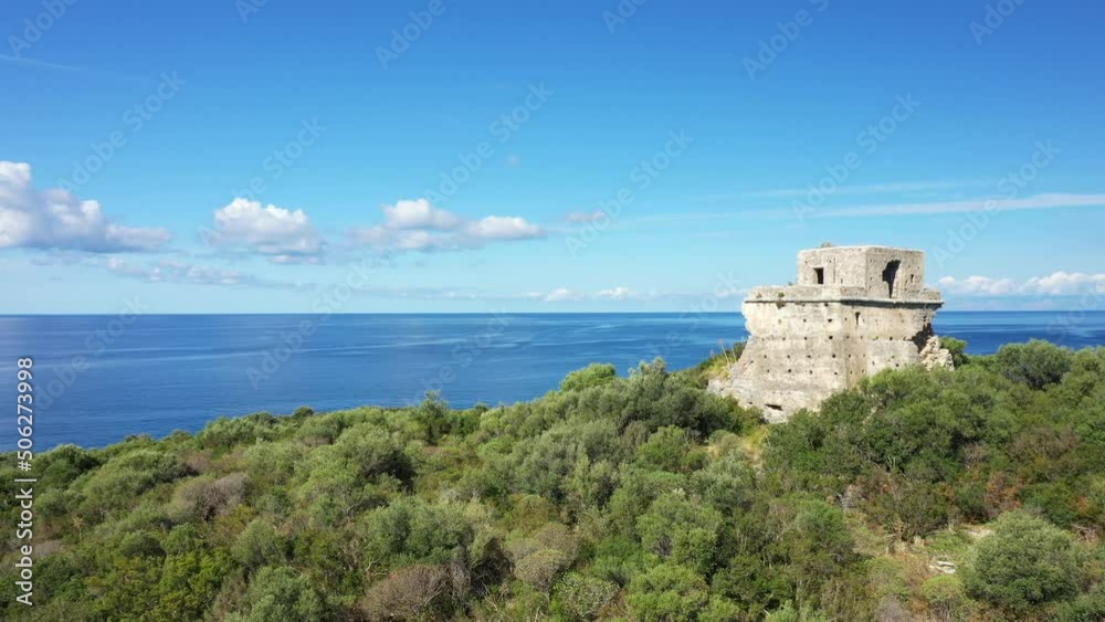 The tower of Isola di Cirella facing the Tyrrhenian Sea in Europe, Italy, Calabria, in summer on a sunny day.