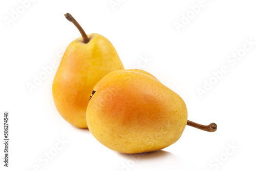 Two yellow ripe pears on white background isolated. Dessert for cooking slice and confectionery. Sweet food, vegetarian. Farm and garden ingredient for market.