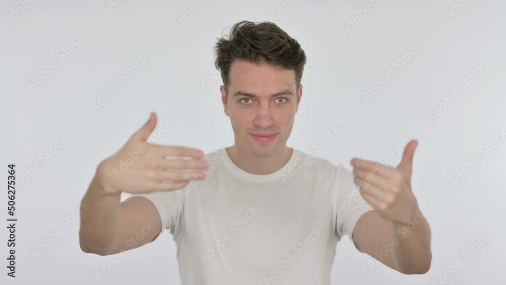 Inviting Young Man Pointing at Camera on White Background Inviting Young Man Pointing at Camera on White Background