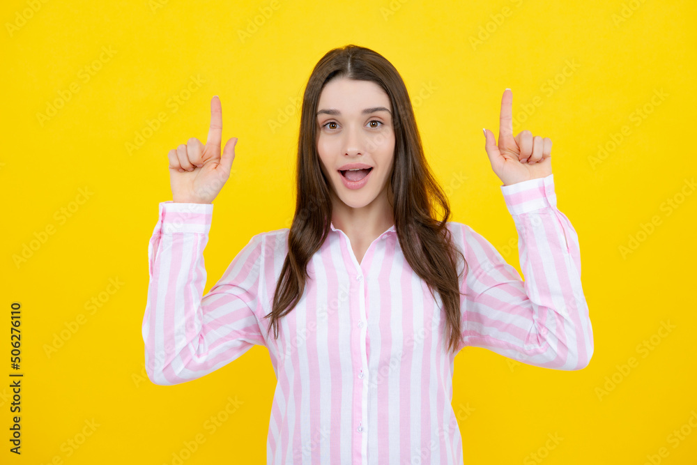 Woman point up at copy space, showing copyspace pointing. Promo, girl showing advertisement content gesture, pointing with hand recommend product. Isolated yellow background. Positive thinking. Woman point up at copy space, showing copyspace pointing. Promo, girl showing advertisement content gesture, pointing with hand recommend product. Isolated yellow background. Positive thinking.