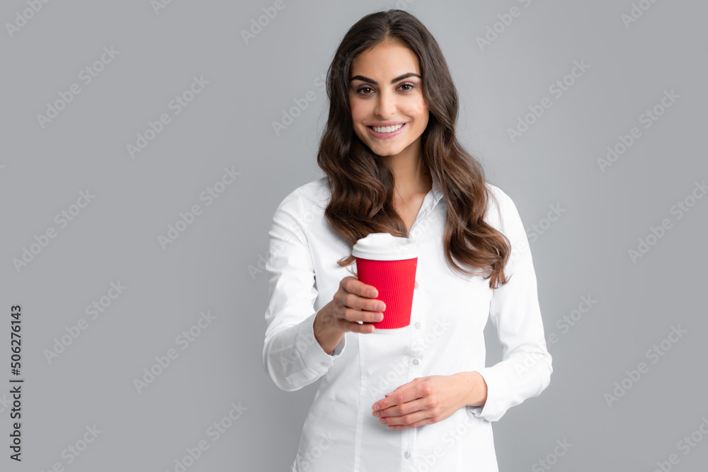 Business woman coffee hild cup coffee over gray background. Business woman coffee hild cup coffee over gray background.