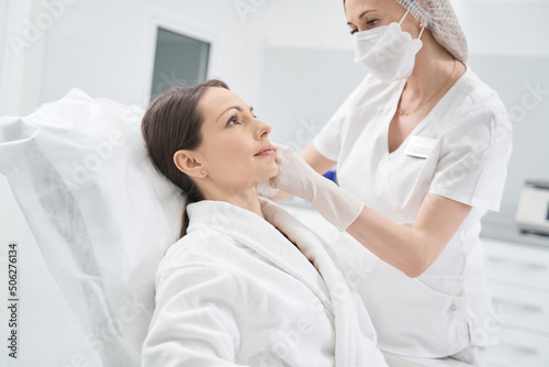 Woman receiving skincare treatment in cosmetology clinic