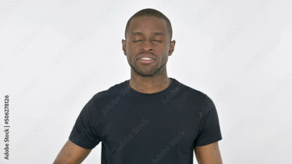 Silence Please, Young African Man with Finger on Lips on White Background Silence Please, Young African Man with Finger on Lips on White Background