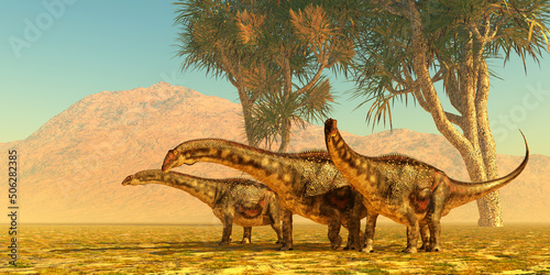 Diamantinasaurus Dinosaur Herd - Diamantinasaurus was a herbivorous sauropod dinosaur that lived in herds in Australia during the Cretaceous Period. photo