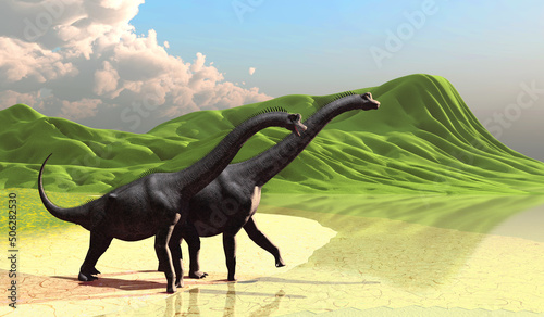 Two Brachiosaurus Dinosaurs - Rolling green hills end at a lakeshore as herbivorous sauropod Brachiosaurus dinosaurs come to the beach during the Jurassic Period.