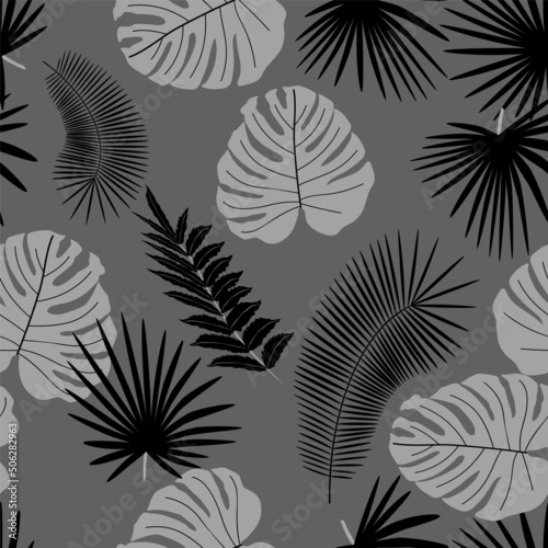 Tropical seamless background palm leaves. Natural beauty.