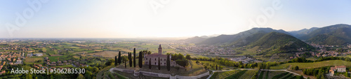 Panoramic Aerial footage view from the drone of a ancient fortress built on a green hill