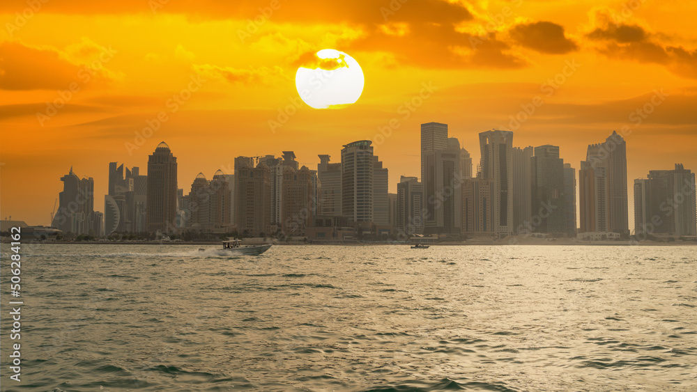 Doha, Qatar- May 15,2022 : Doha skyline with many towers during a summer day. Doha, Qatar- May 15,2022 : Doha skyline with many towers during a summer day.