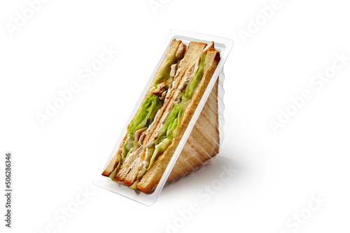 Sandwiches with chicken meat and lettuce in container