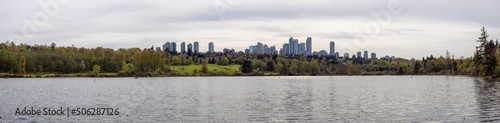 Scenic view of a modern city park by the lake. Spring Season. Deer Lake, Burnaby, Vancouver, British Columbia, Canada. Panorama