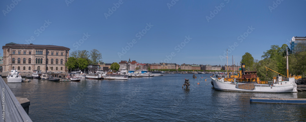 Bay view with commuting boats and cultural buildings a sunny day in Stockholm
