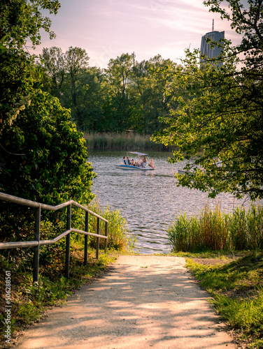 Canvas Print Path to the lake,  sailing boat in the background