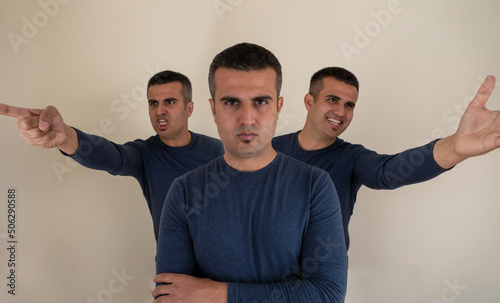 Portrait of a man with tree different emotional face expressions as a symbol of instat personality shifts. Concept of bipolar , unipolar and borderline mental disorder.